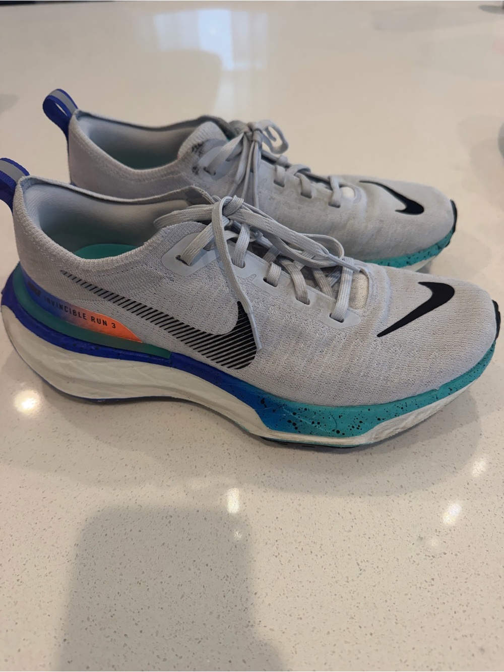 Nike Mens size 8 or Women’s 9.5 Grey ZoomX Invincible Sneakers with Blue Accents